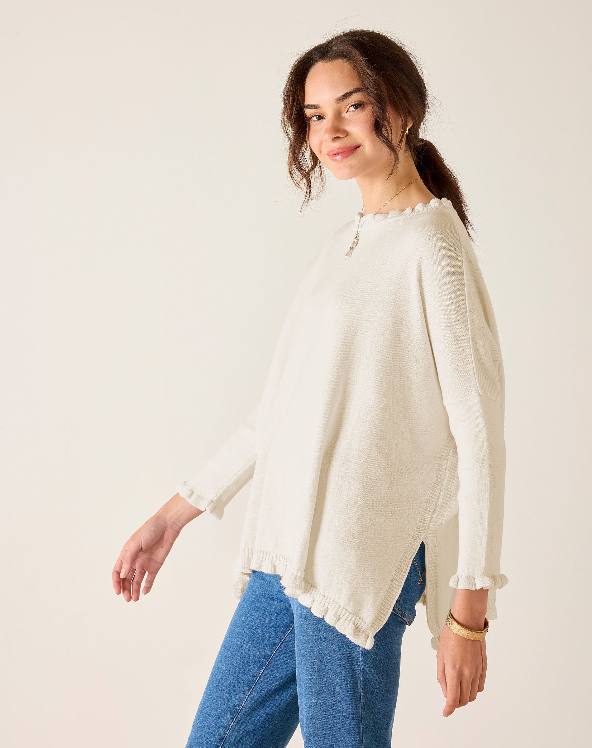 MERSEA ladies' travel-ready warm white ruffle knit sweater with a tiered hem and lace-trimmed edges.