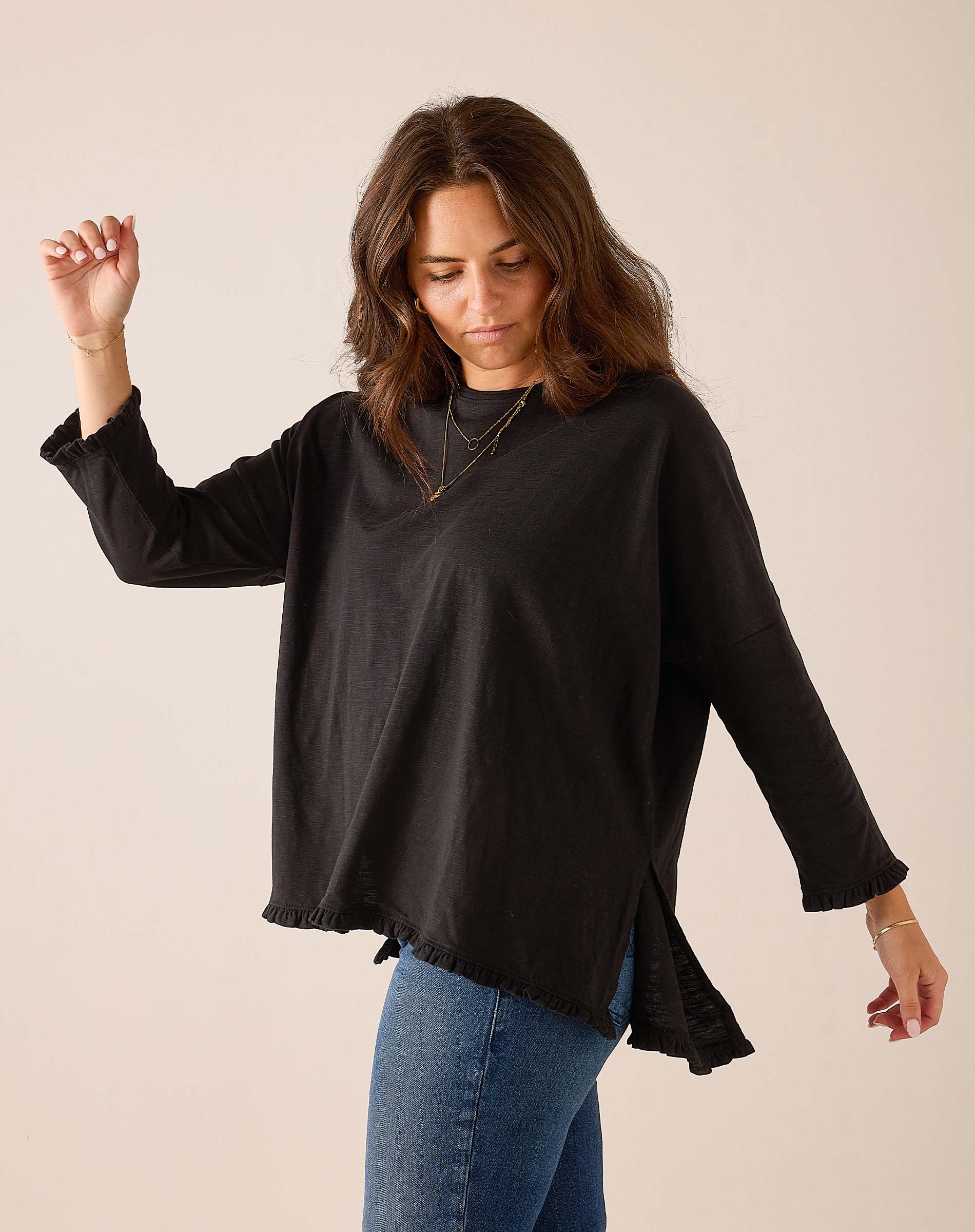 Black relaxed fit linen-blend ruffled tee with split side seams.