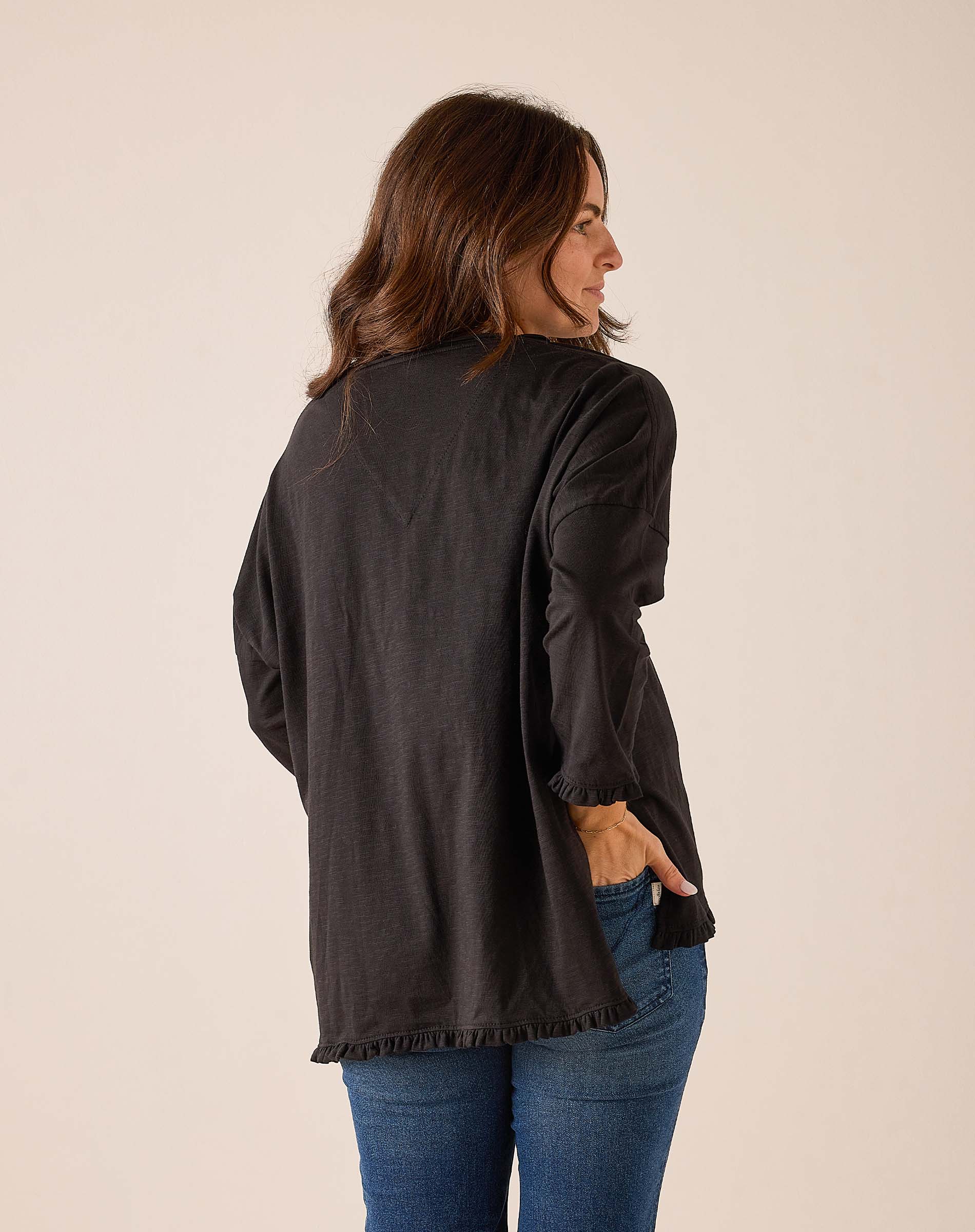 Black ruffle tee with billowy sleeves and gathered hem