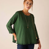 MERSEA ladies' travel-ready fairway green cotton knit ruffle tee with a relaxed fit and ruffled hem.