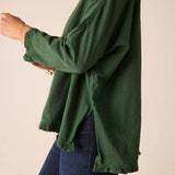 Fairway green ruffled tee with a relaxed fit and long sleeves.