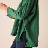 Fairway green ruffled tee with long sleeves and a flared hem.