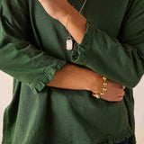 Fairway green ruffled tee with a loose fit and textured fabric.