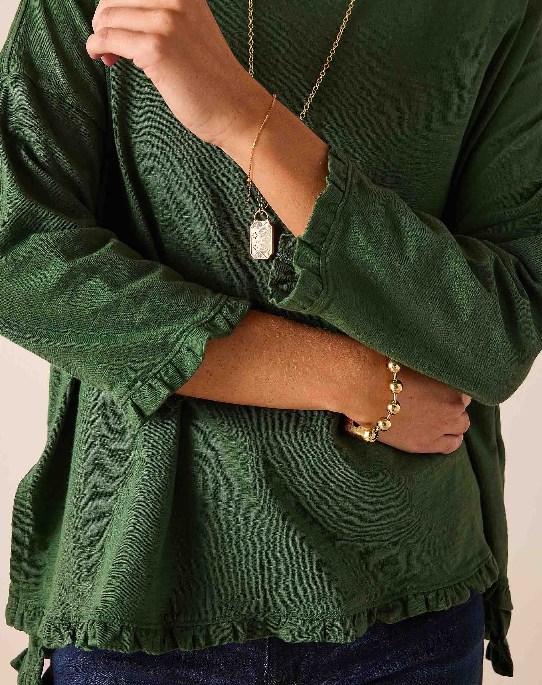 Fairway green ruffled tee with a loose fit and textured fabric.