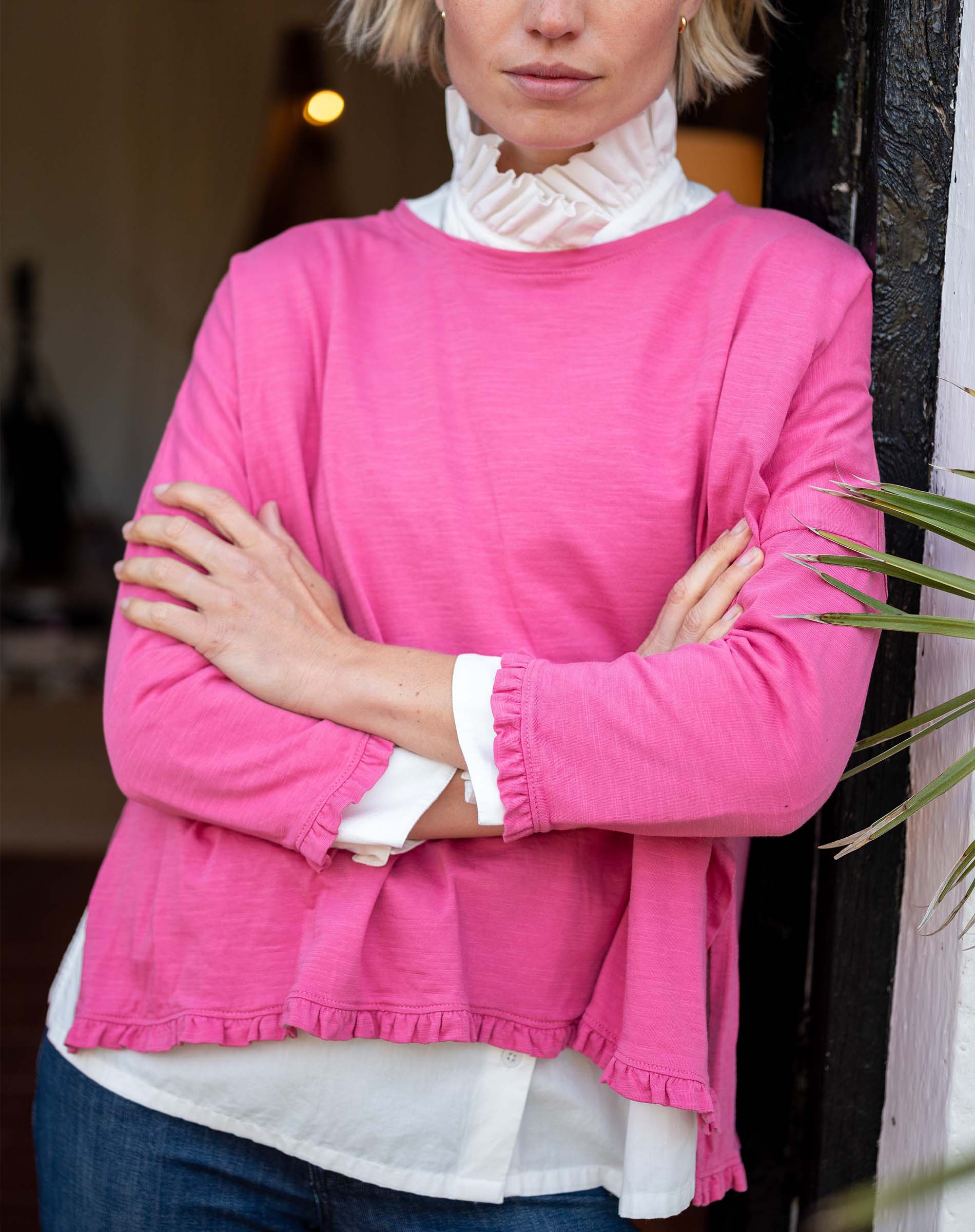 Rapture Rose ruffle tee with a tiered hem and long sleeves.