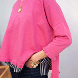 Rapture Rose ruffled tee with a relaxed fit and ruched details at the hem and sleeves.