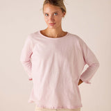 MERSEA women's travel-friendly rose quartz long-sleeve tee in a soft knit with ruffled trim at the hem and cuffs.