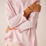 Rose quartz loose-fit cotton t-shirt with ruffle details on the sleeves and hem.
