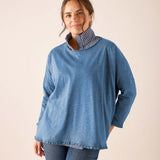 Ladies' travel-ready slate blue knit ruffle tee with a striped collar detail.