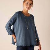 MERSEA women's travel-friendly slate blue ruffle tee with three-quarter length sleeves and a draped silhouette.