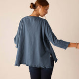 Back view of the slate blue ruffled tee with 3/4 sleeves and a relaxed fit.