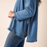 Slate blue ruffled tee with a relaxed fit and cotton texture.