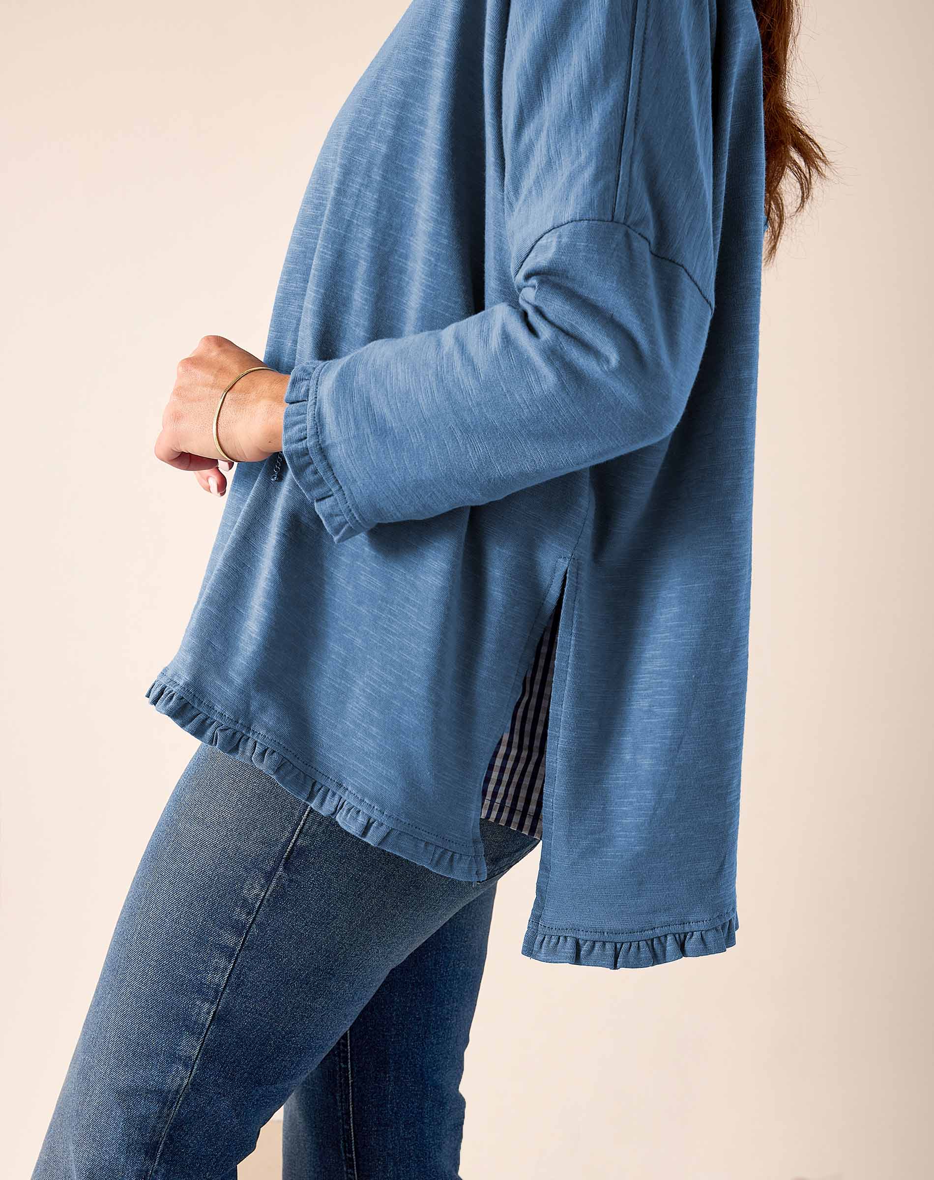 Slate blue ruffled tee with a relaxed fit and cotton texture.