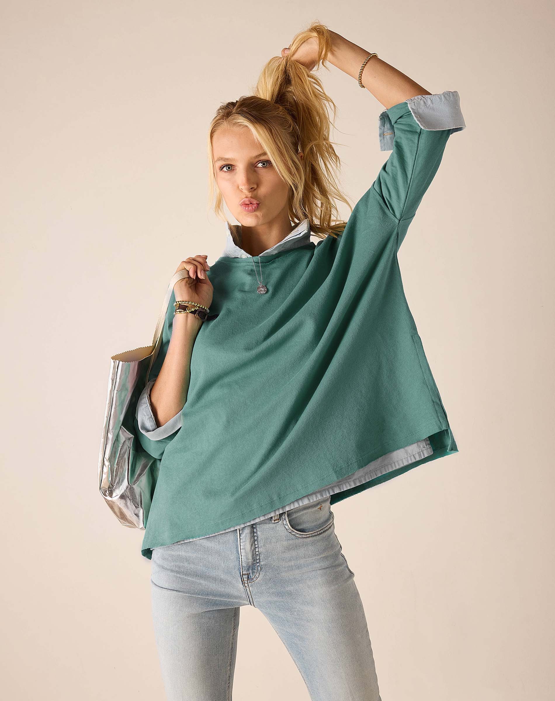Ladies' travel-ready aqua blue oversized tee with short sleeves and a relaxed fit.