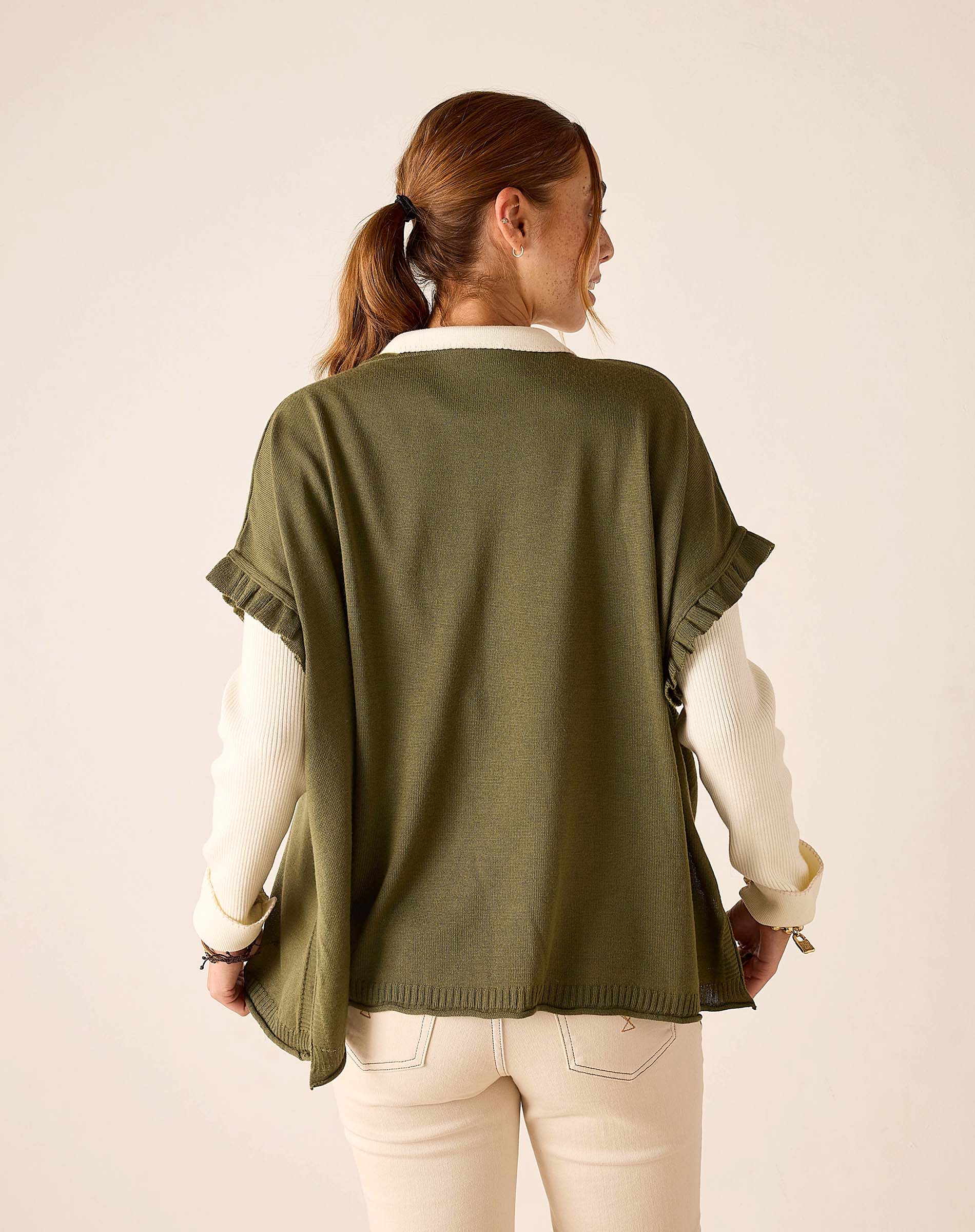 Back view of moss green short-sleeve ruffle sweater.