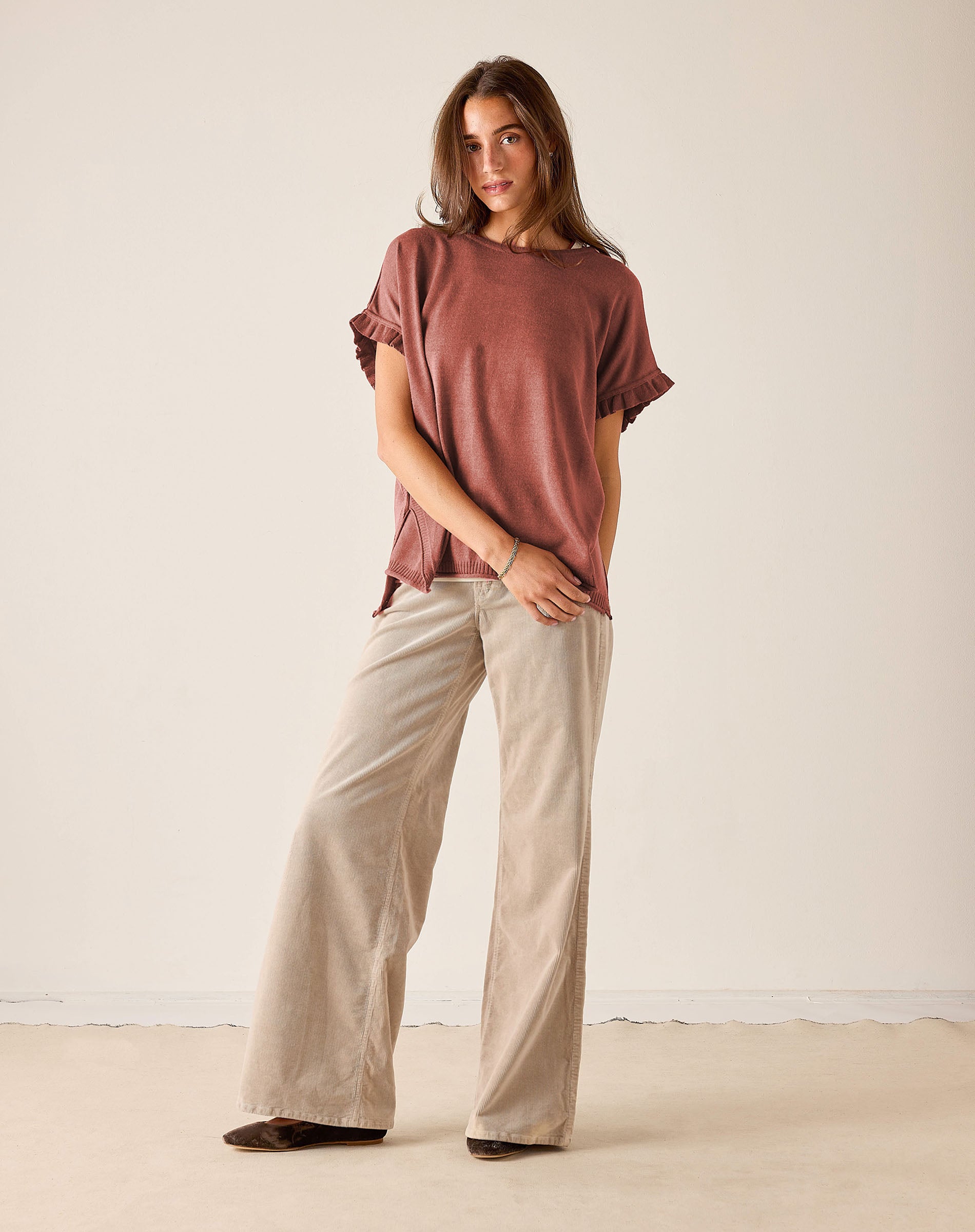 MERSEA women's travel-friendly burnt brick short-sleeve knit top with ruffle detailing on the sleeves.