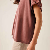 Burnt brick short-sleeve knit sweater with ruffled edges and a relaxed fit.