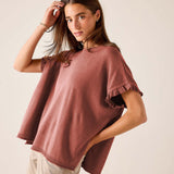 Burnt brick short-sleeved sweater with a relaxed fit and ruffled sleeves.