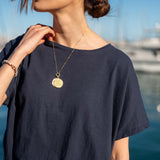 Ladies' travel-ready navy blue short-sleeve tee with a crew neck and relaxed fit.