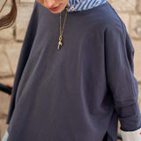 Indigo slub tee with a striped inner collar and cuff detail.