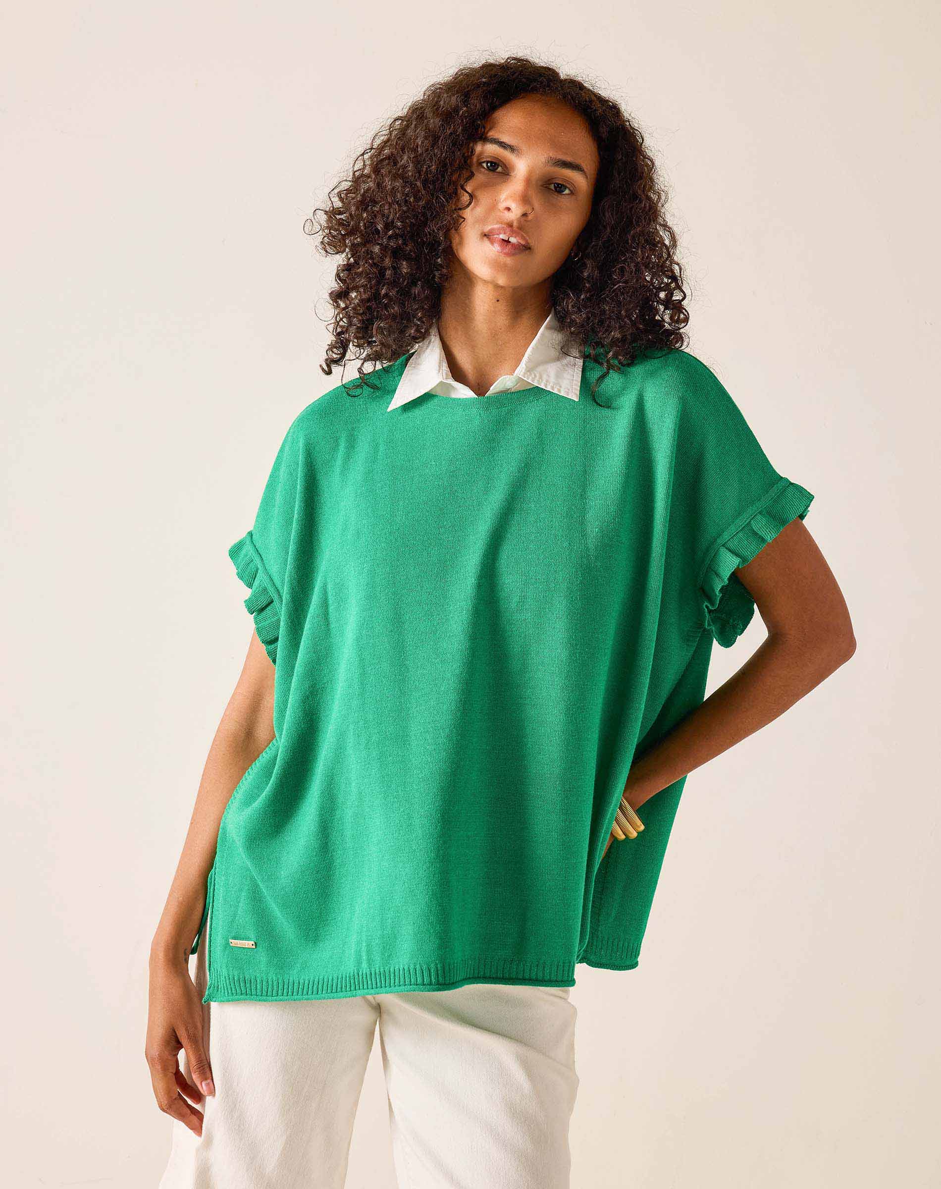 Vibrant green short sleeve sweater with ruffled edges and a relaxed fit.