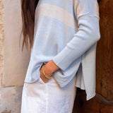 Light blue cardigan worn by a person with a neutral background