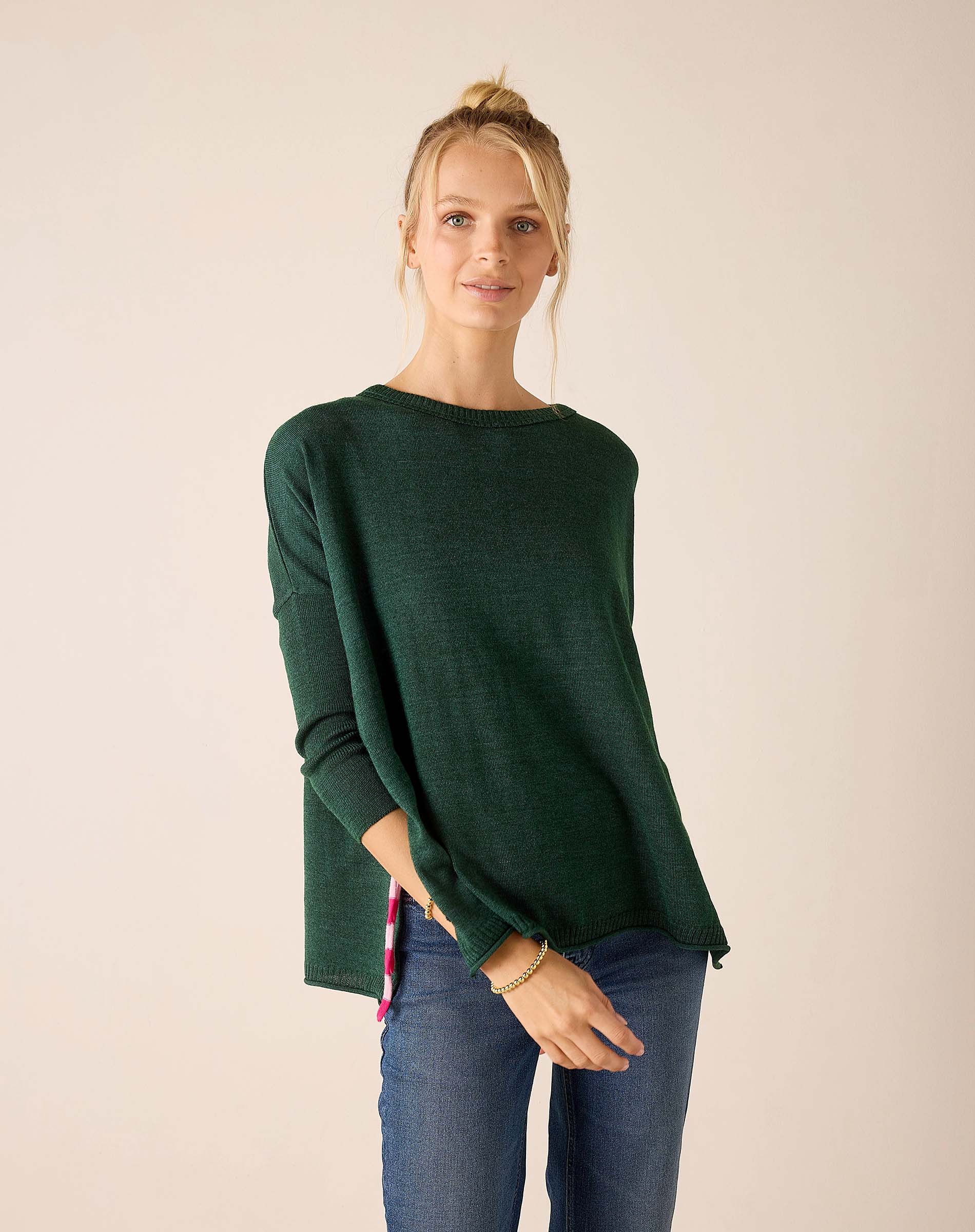 Forest green oversized knit sweater with a relaxed fit and soft knit texture.