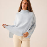 Sky blue oversized turtleneck knit sweater with ribbed cuffs and hem.