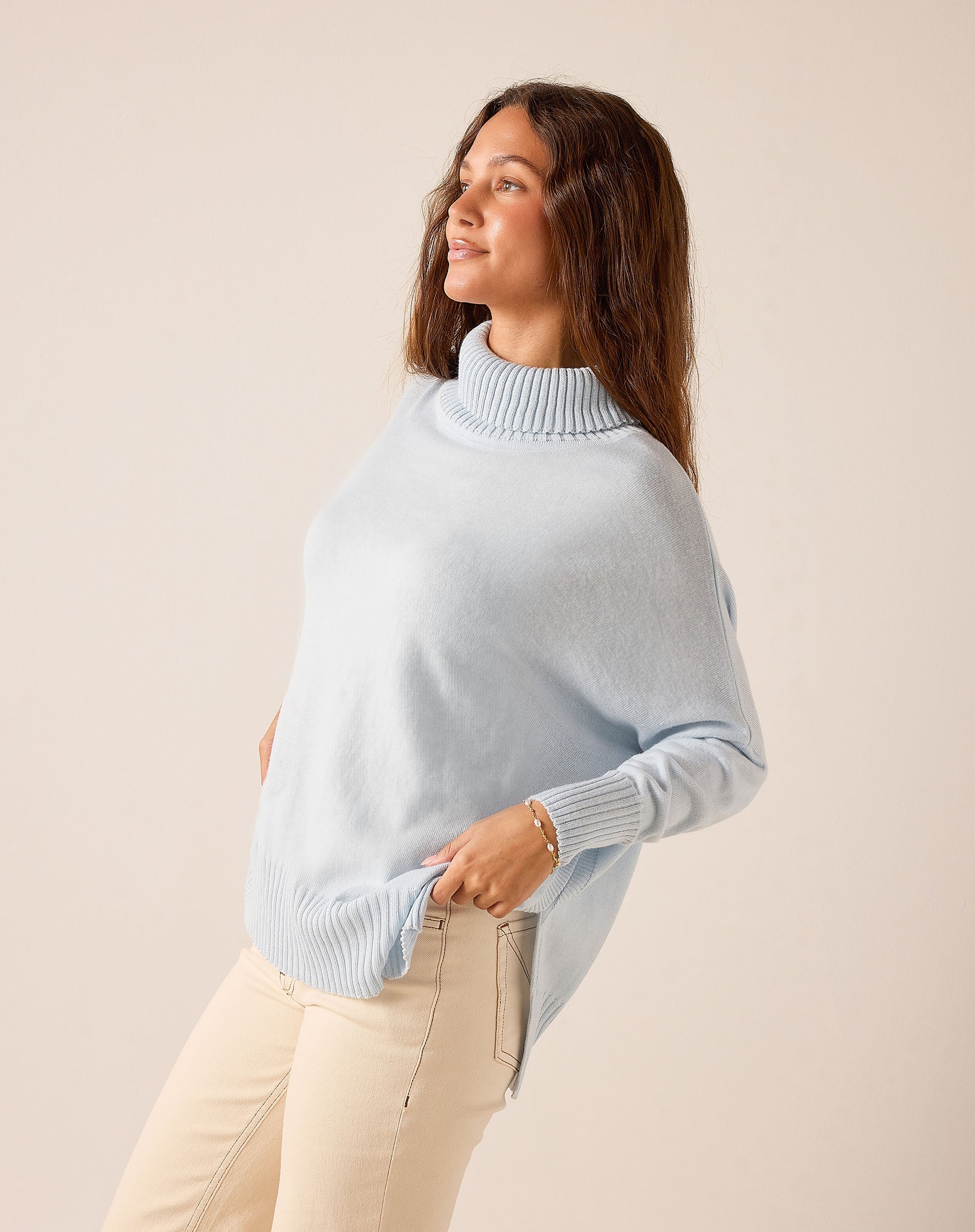 Sky blue relaxed-fit knit turtleneck sweater with ribbed cuffs and hem.