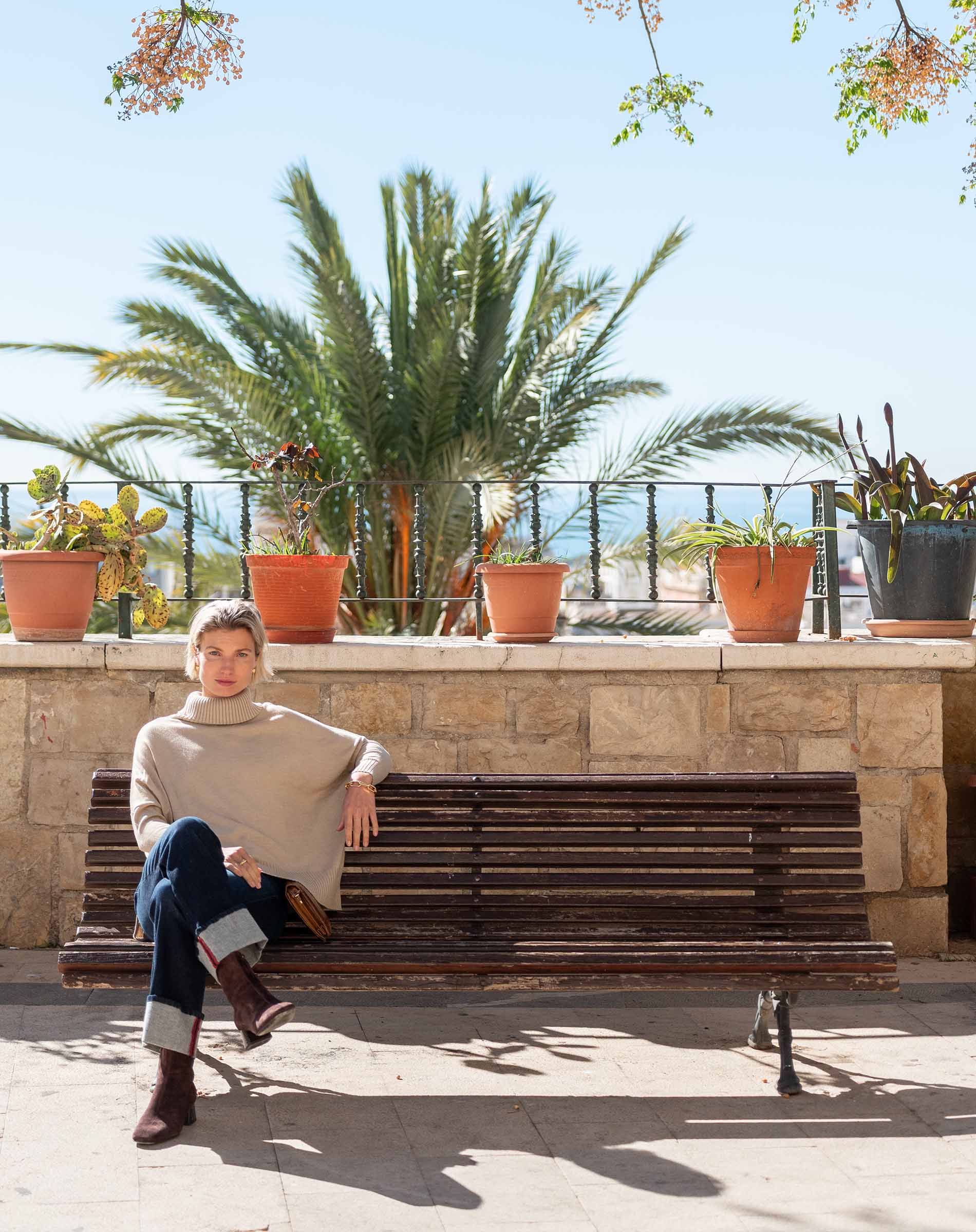 Women's travel-friendly putty colored oversized turtleneck knit sweater.