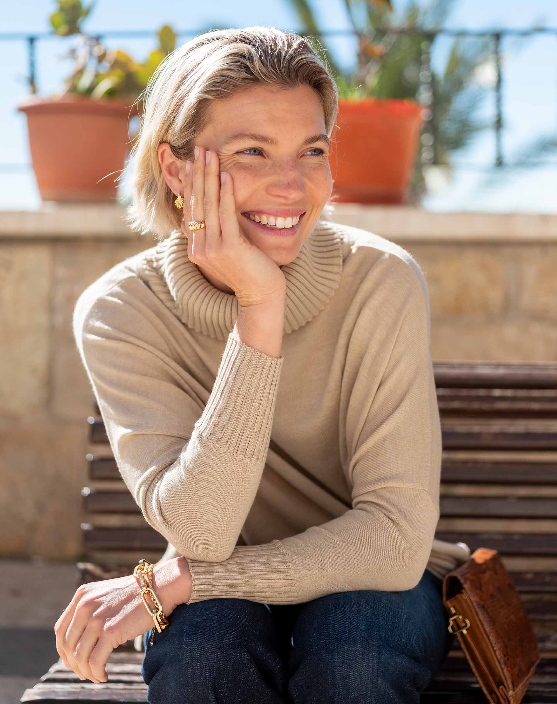 Putty color ribbed knit Catalina turtleneck sweater with a cozy fold-over neck.