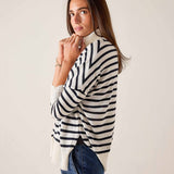 White and navy striped ribbed knit turtleneck sweater