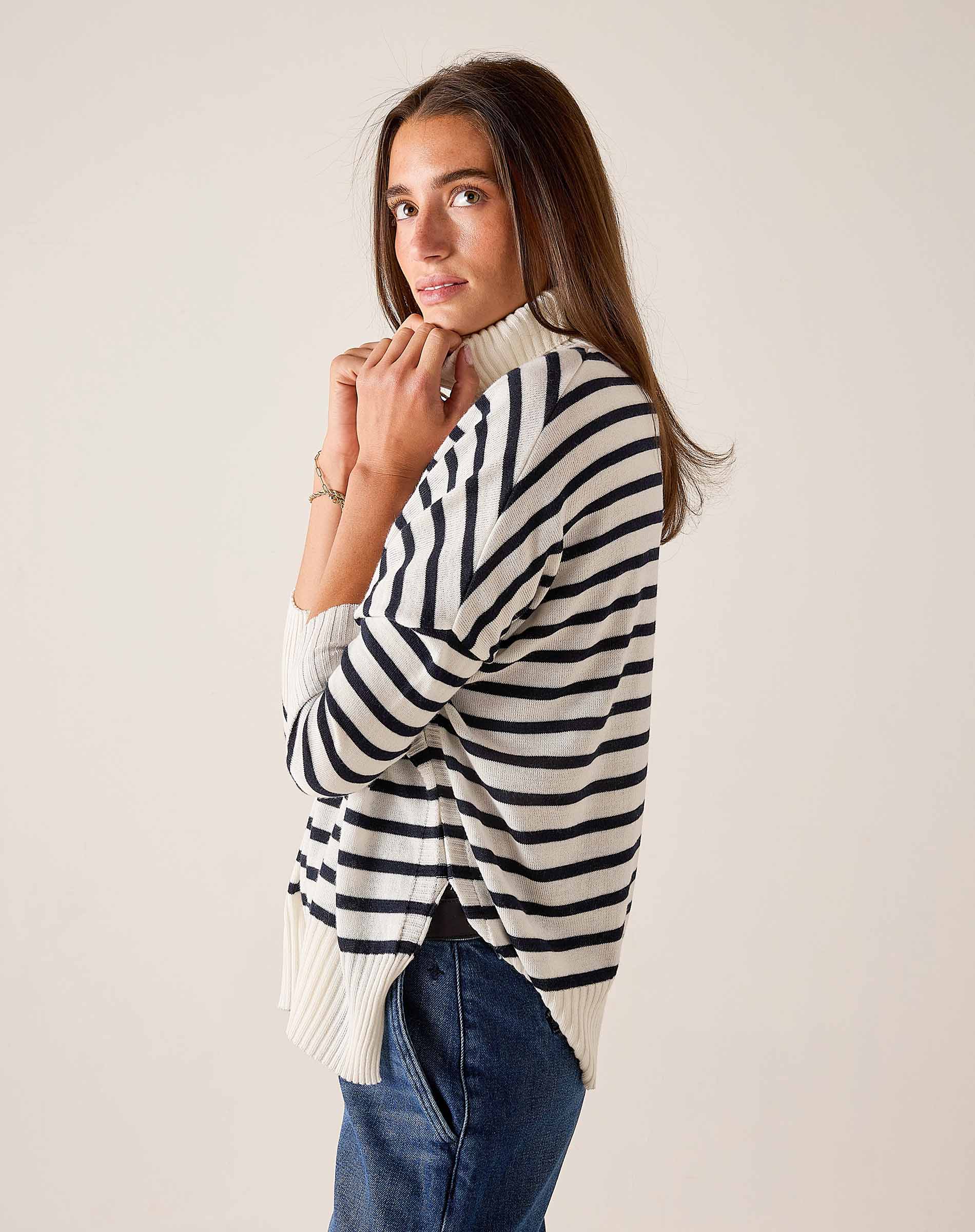 White and navy striped ribbed knit turtleneck sweater