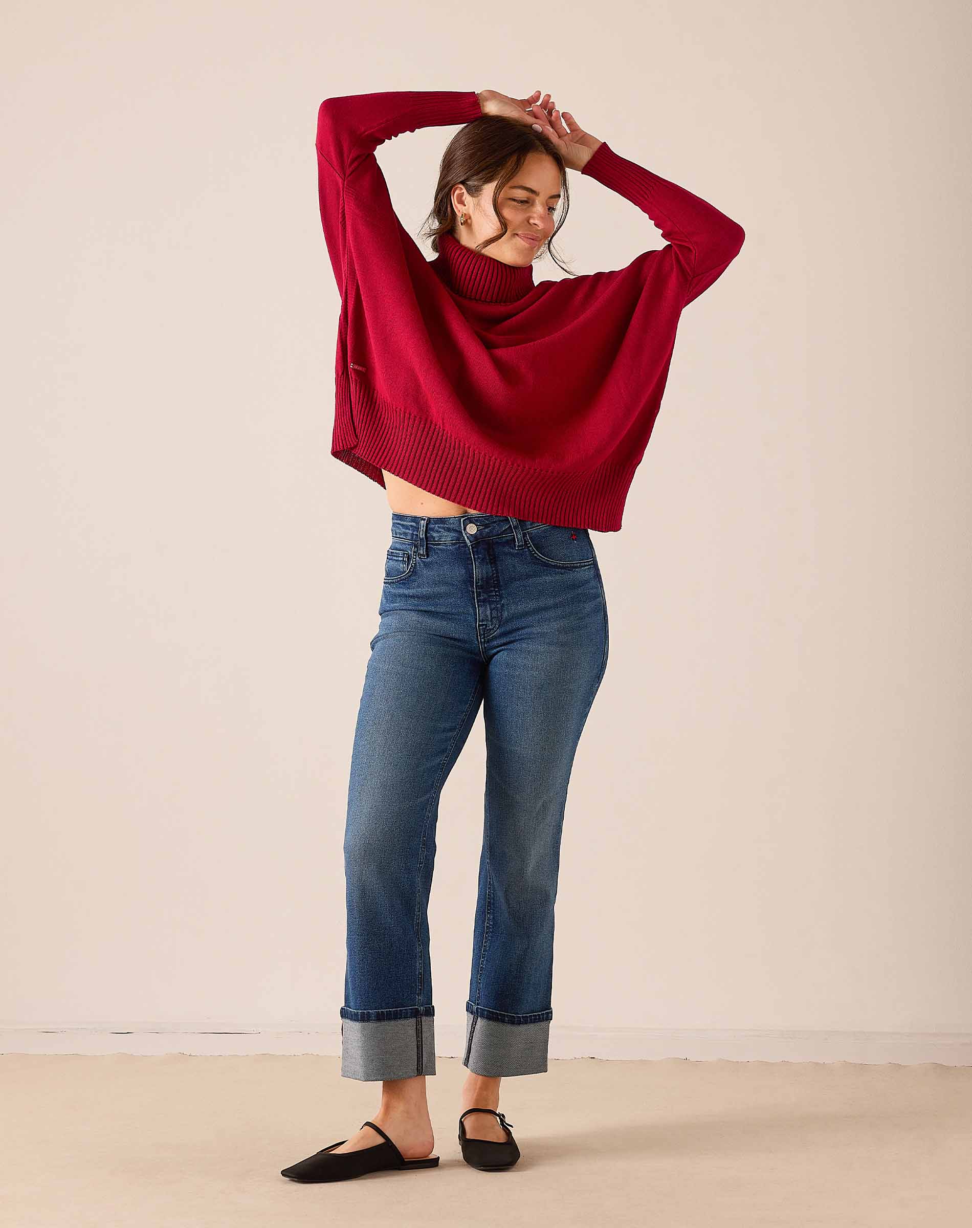 Ladies' travel-ready wine red oversized knit turtleneck sweater with a relaxed fit.