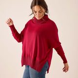 Wine red ribbed knit turtleneck sweater with a loose fit and dropped shoulders.