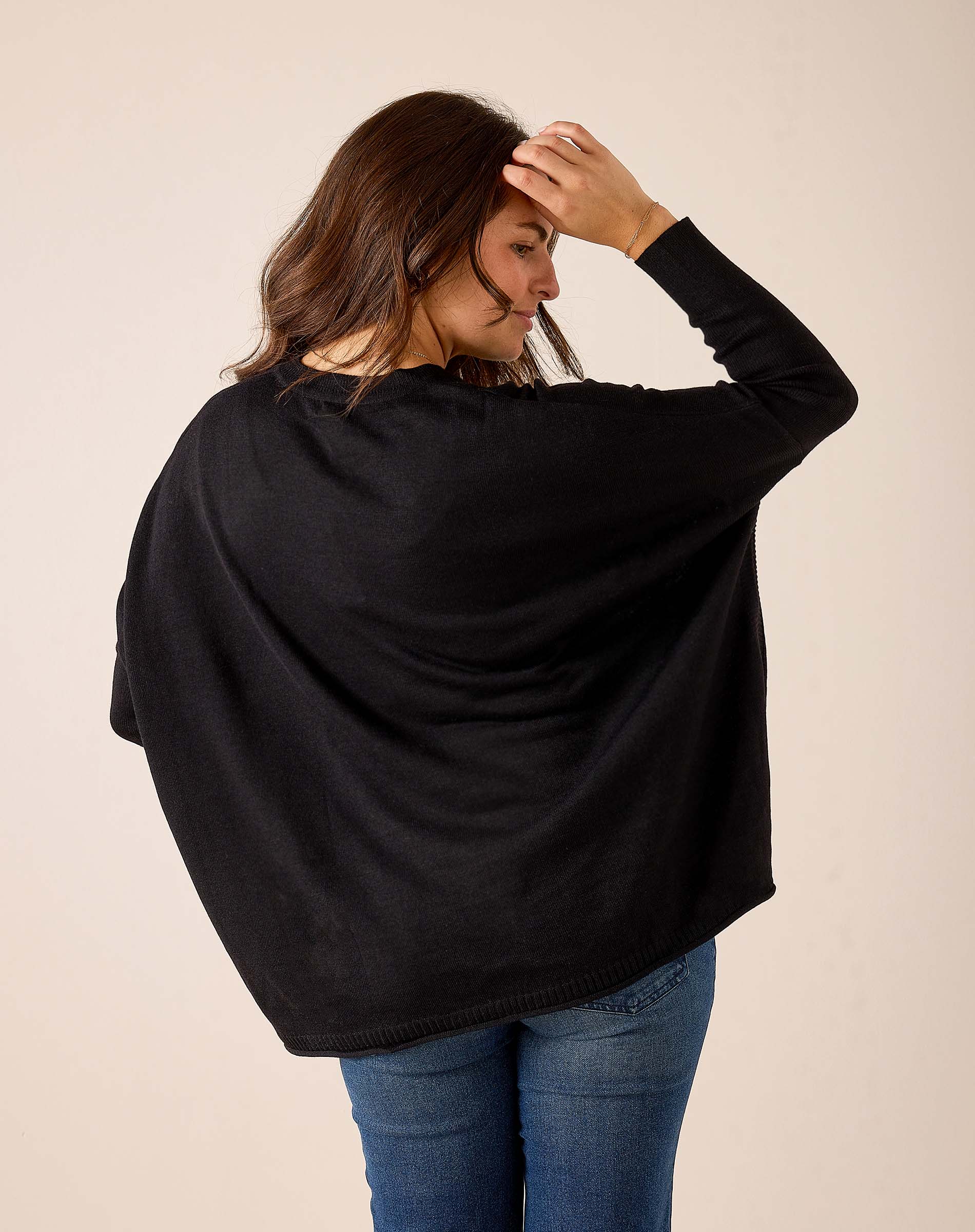 Black knit Catalina V-neck sweater with a relaxed fit.