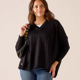 Black V-neck knit sweater with a relaxed fit.