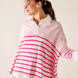 Woman wearing a pink and white striped sweater over a white shirt.