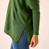 Emerald green ribbed knit v-neck sweater with a relaxed fit and draped front hem.