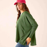 Emerald green knit V-neck sweater with a relaxed fit.
