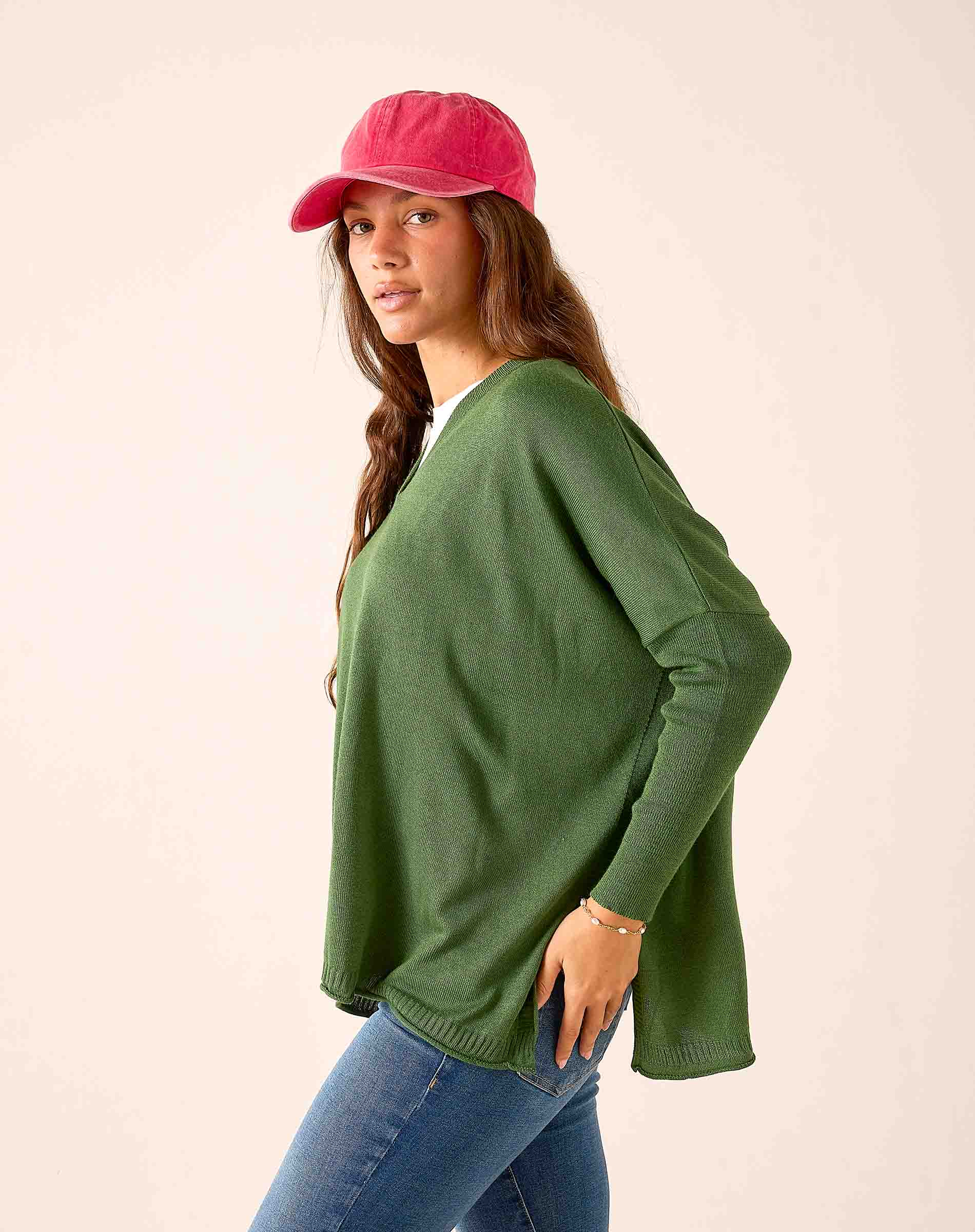 Emerald green knit V-neck sweater with a relaxed fit.