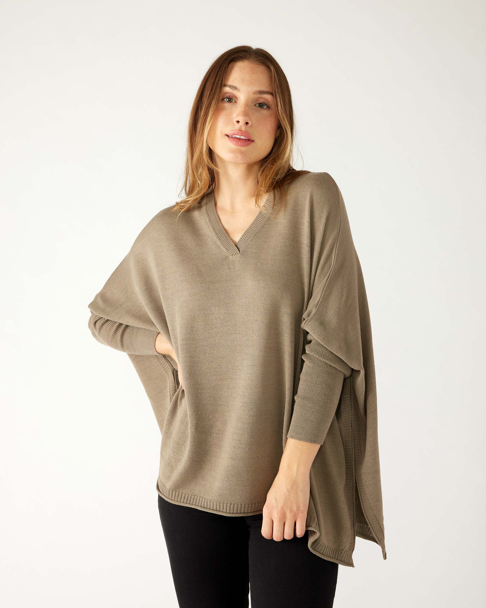 woman wearing mersea catalina v-neck sweater in hazelnut color
