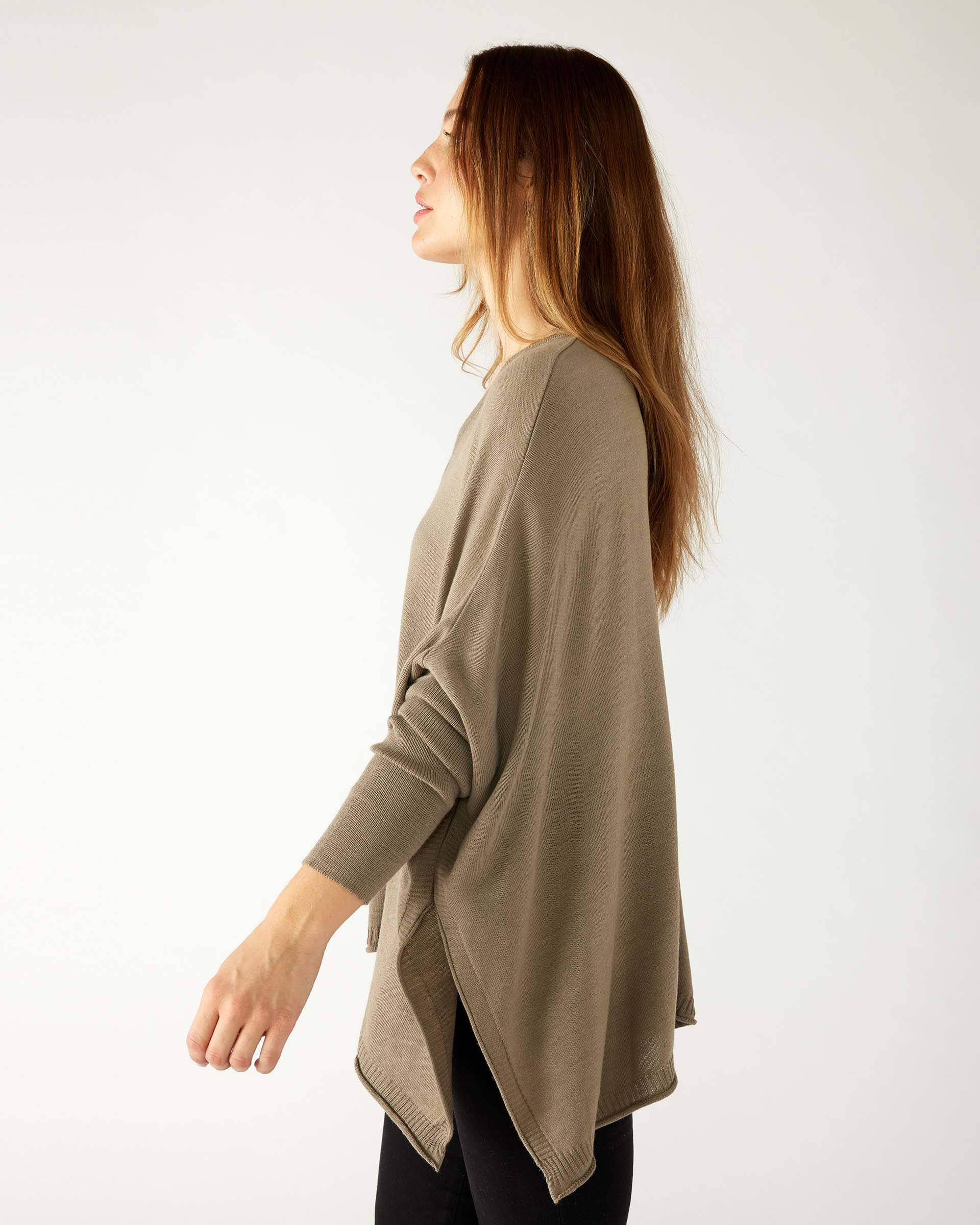 profile of woman wearing mersea catalina v-neck sweater in hazelnut color