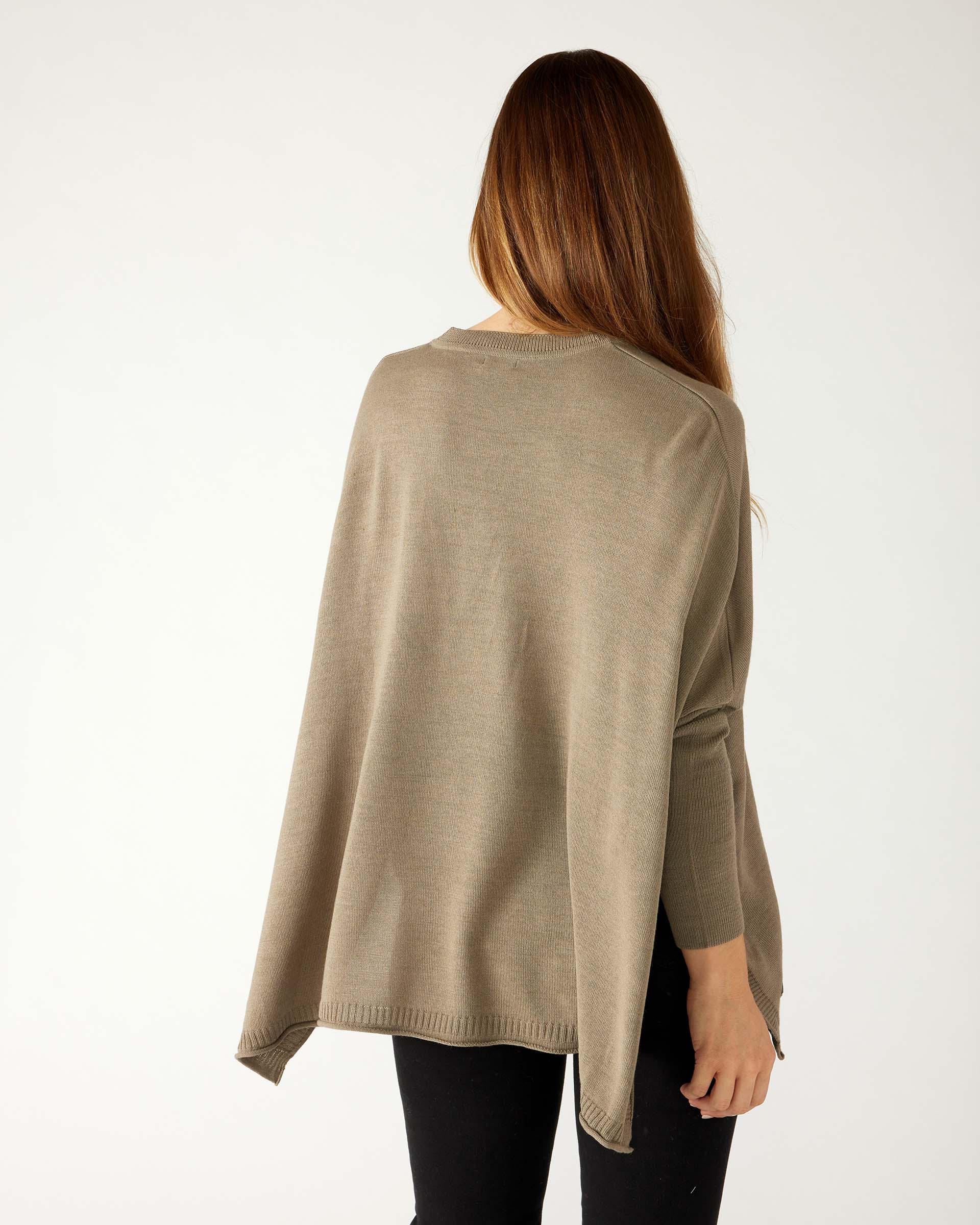 rearview of woman wearing mersea catalina v-neck sweater in hazelnut color