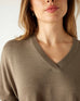 closeup of vneck on woman wearing mersea catalina v-neck sweater in hazelnut color