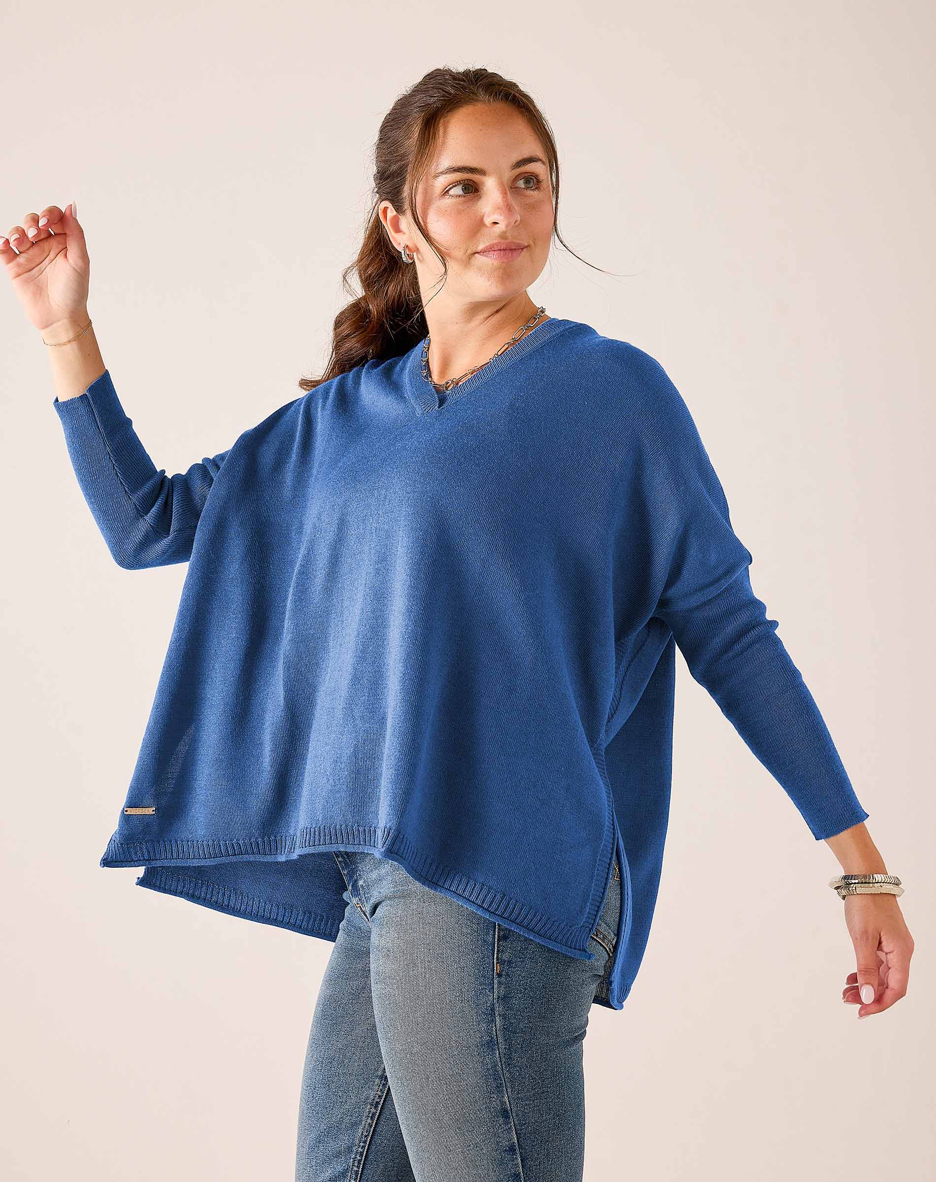 MERSEA women's travel-friendly ocean blue oversized V-neck knit sweater with a relaxed fit and draped silhouette.