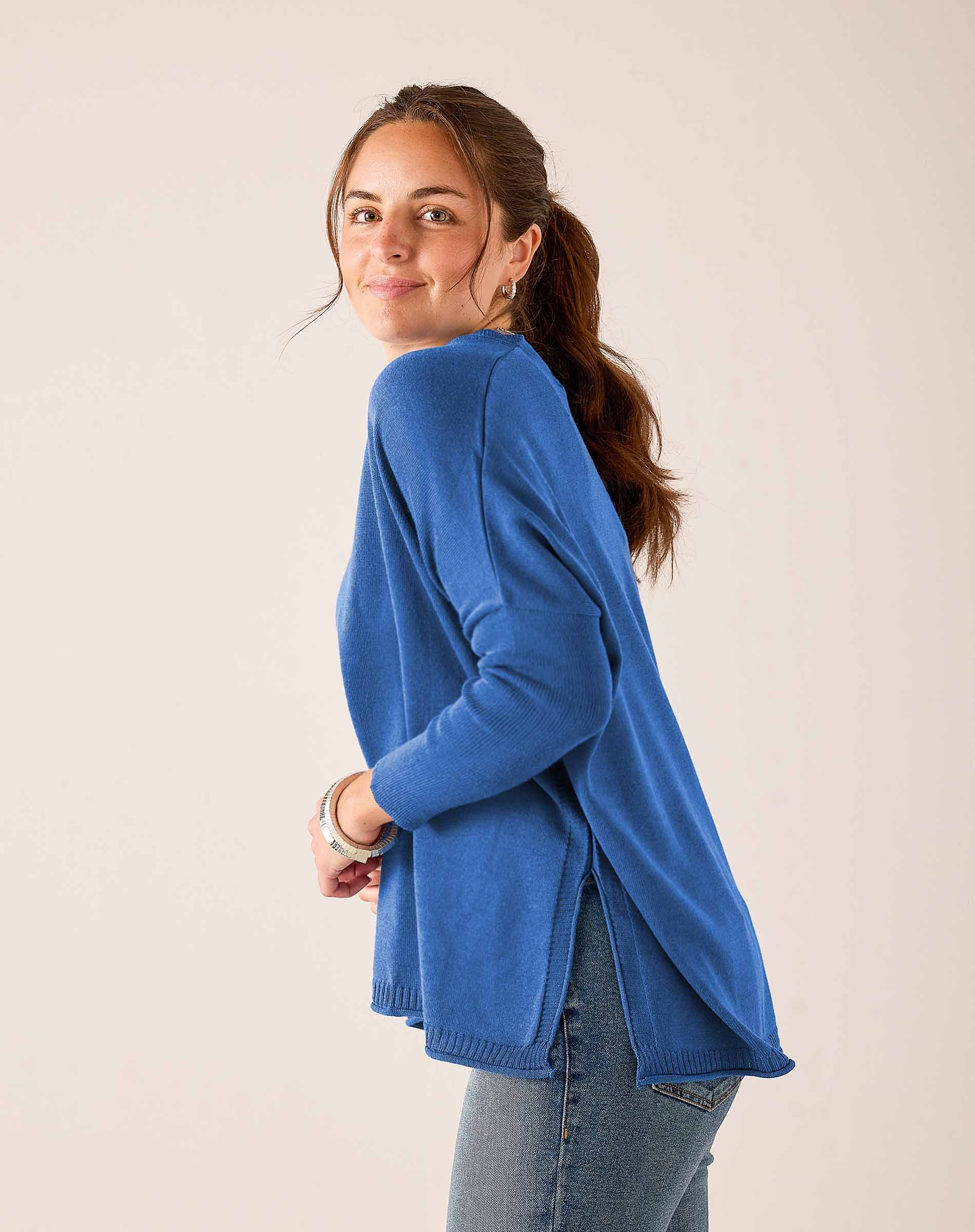 Ocean blue relaxed fit knit Catalina V-neck sweater with dropped shoulders and long sleeves.