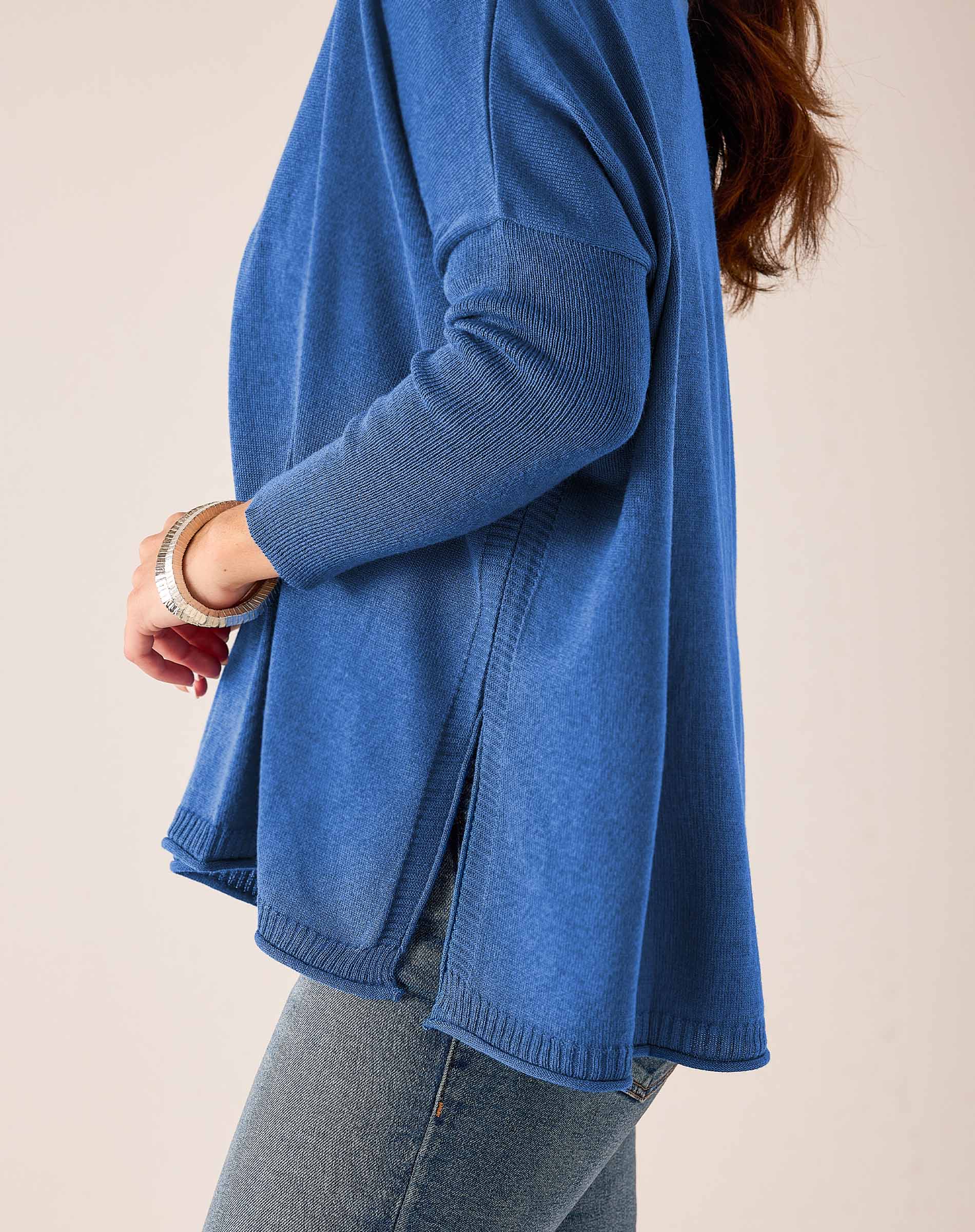 Ocean blue ribbed knit V-neck sweater with wide sleeves
