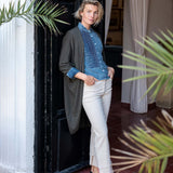 Ladies' travel-ready stonewash chambray tuxedo shirt with a buttoned front and tailored fit.