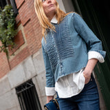 Stonewash blue chambray tuxedo shirt with a unique quilted panel design and rolled sleeves.